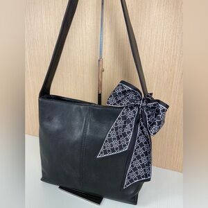 HOBO International genuine leather shoulder bag in classic black.